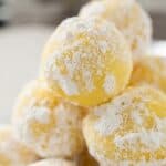 Lemon white chocolate truffles coated in powdered sugar for an easy no-bake dessert.