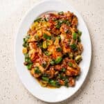 Scallion chicken made with juicy pan-fried chicken thighs, savory sauce, and fresh green onions.