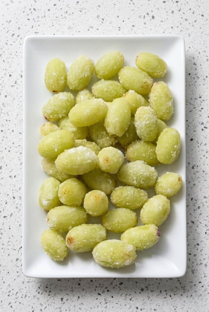 Frozen sugar-coated grapes for refreshing Sour Patch Grapes snack.