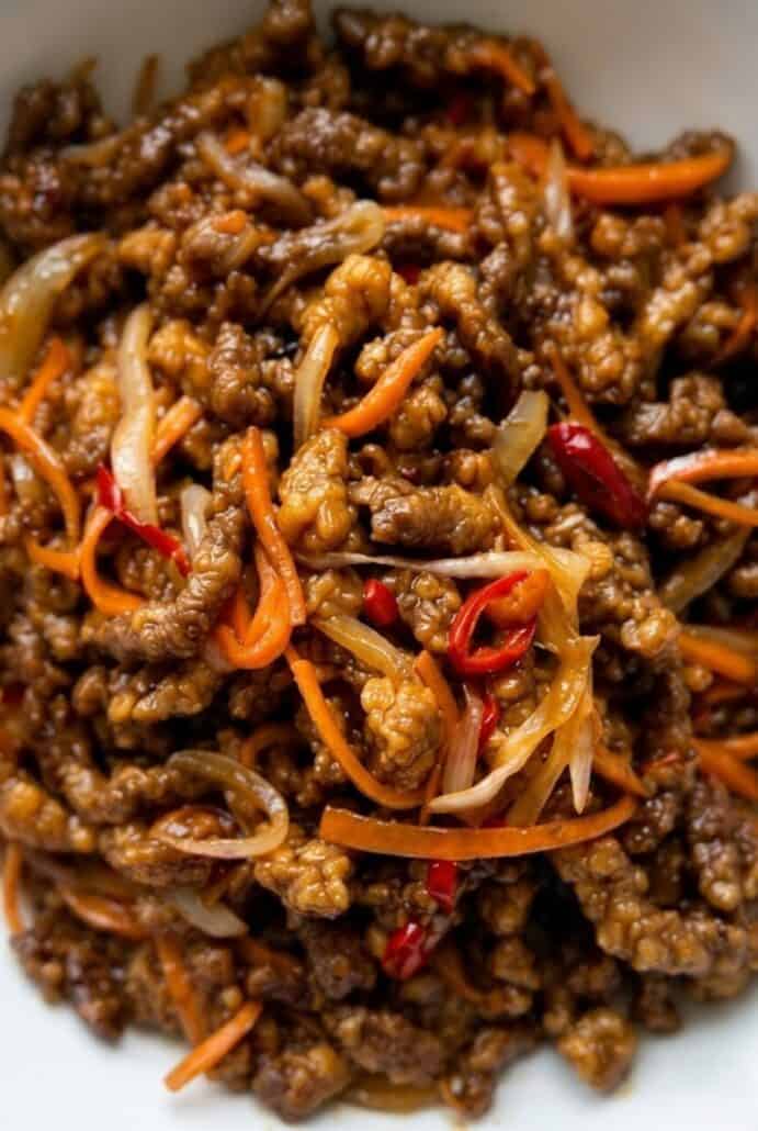 Crispy chilli beef with carrots and red chilli in a sticky sauce.