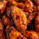Hot Honey Peach Wings coated in a sticky sweet and spicy peach glaze.