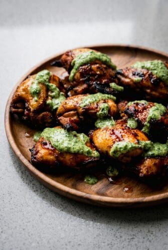Peruvian Chicken with Green Sauce Recipe – Juicy, Smoky & Bursting with Flavor Grilled Peruvian chicken with creamy green sauce on a plate.
