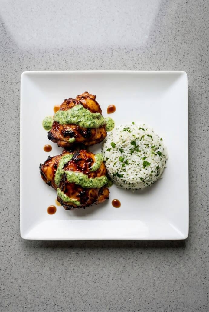 Peruvian chicken with green sauce served with cilantro rice.