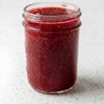 Homemade strawberry jam in a glass jar for an easy fresh strawberry jam recipe.
