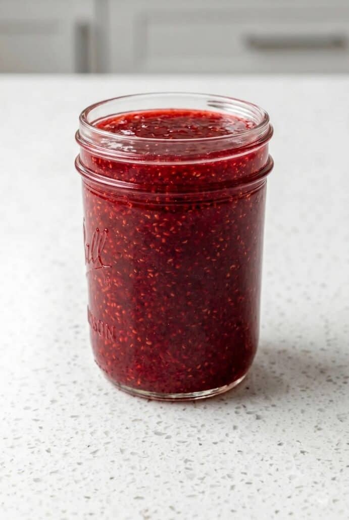 Homemade strawberry jam in a glass jar for an easy fresh strawberry jam recipe.