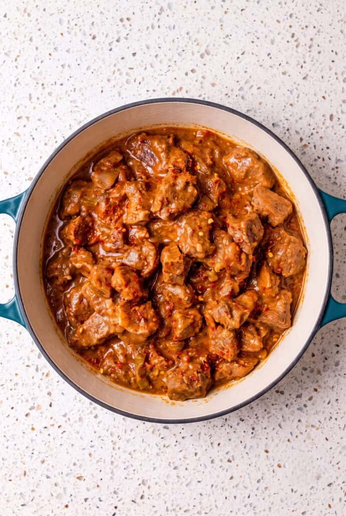 Homemade carne guisada with tender beef simmered in a thick, savory tomato gravy.
