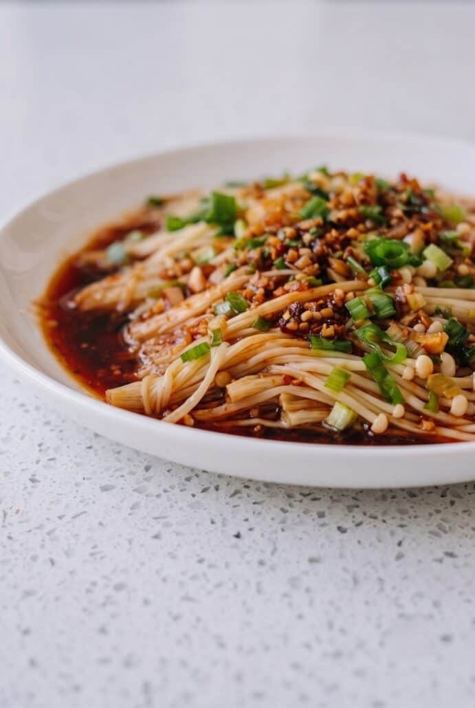 Finished enoki mushrooms with garlic and scallion sauce, ready to serve.