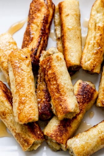 French Toast Roll-Ups with Sausage Recipe Golden sausage-filled French toast roll-ups for an easy breakfast recipe.