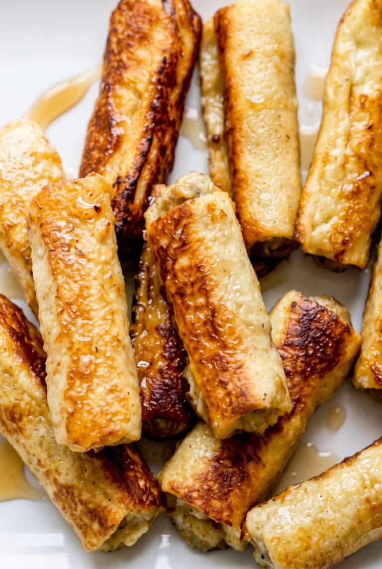 Golden sausage-filled French toast roll-ups for an easy breakfast recipe.