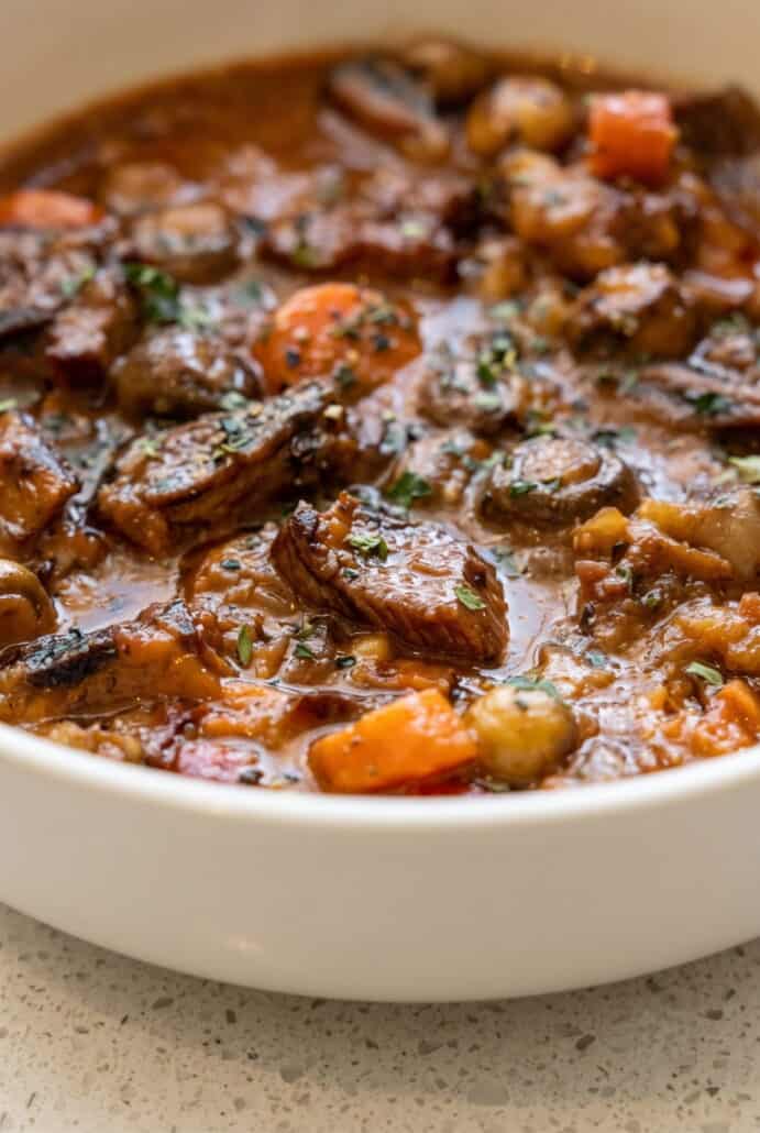 Close-up of Beef Carbonnade Stew with tender beef and onions in a rich beer sauce.
