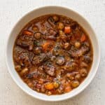 Beef Carbonnade Stew with tender beef, carrots, mushrooms, and onions in a rich beer sauce.