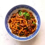 Black pepper beef udon with tender beef, chewy noodles, vegetables, and savory pepper sauce.