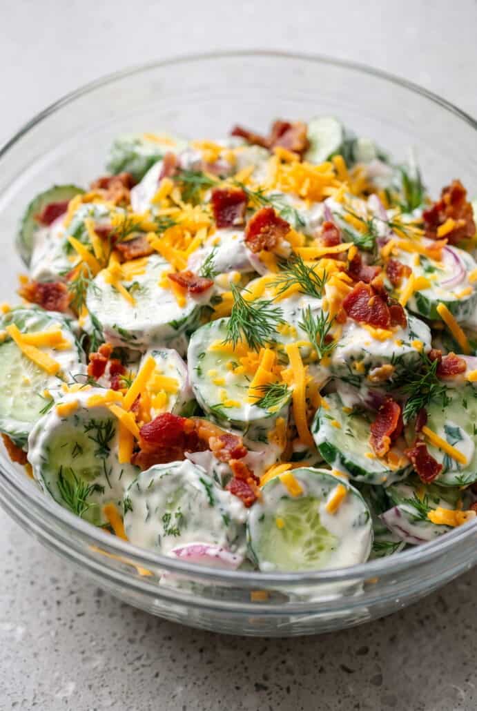 Creamy cucumber ranch crack salad with cheddar, bacon, and fresh dill.