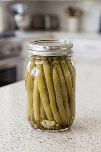 Homemade Dilly Beans (Old Fashioned Dill Pickled Green Beans) Jar of homemade dill pickled green beans ready for serving or pantry storage.