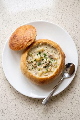 Homemade Bread Bowls Recipe from Scratch Homemade bread bowl filled with creamy soup, served with the bread top on the side.