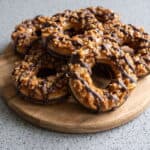 Homemade Samoas cookies with toasted coconut, caramel, and chocolate drizzle.