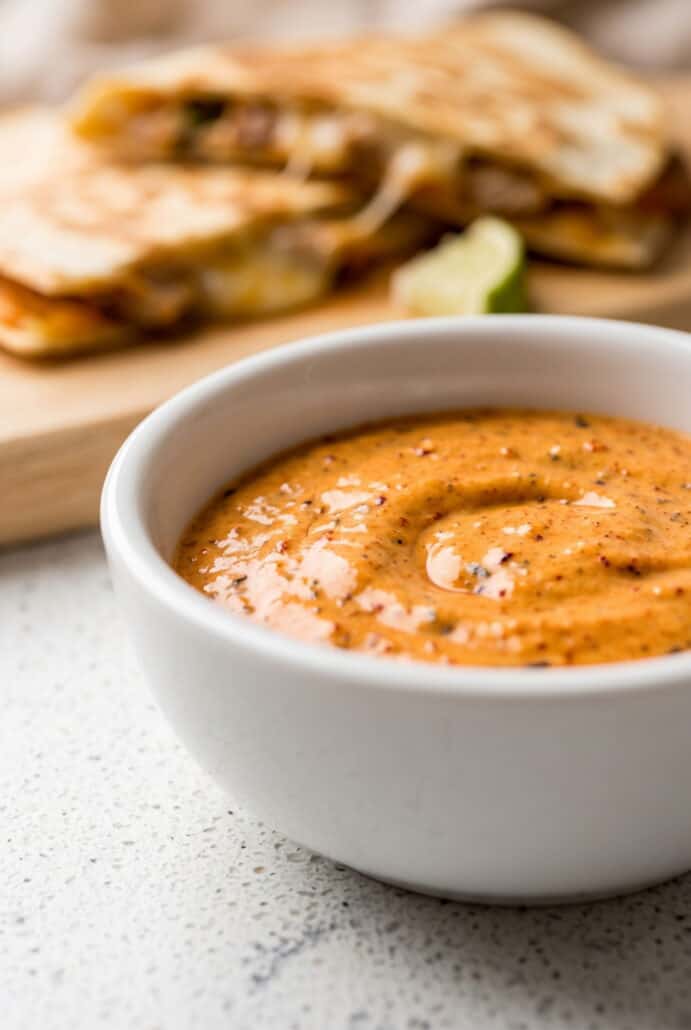 Creamy chipotle garlic sauce with sour cream, perfect for tacos, burgers, and dipping.