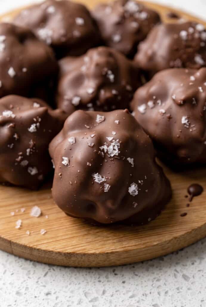 Close-up of chocolate strawberry yogurt bites topped with sea salt, ready to enjoy.