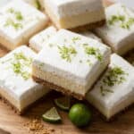 Key lime pie bars with creamy lime filling, whipped topping, and fresh lime zest.