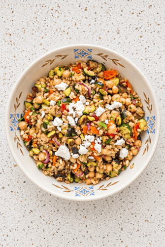 Mediterranean Farro Salad Recipe with Chickpeas Mediterranean farro salad with roasted vegetables, chickpeas, feta, and fresh herbs.
