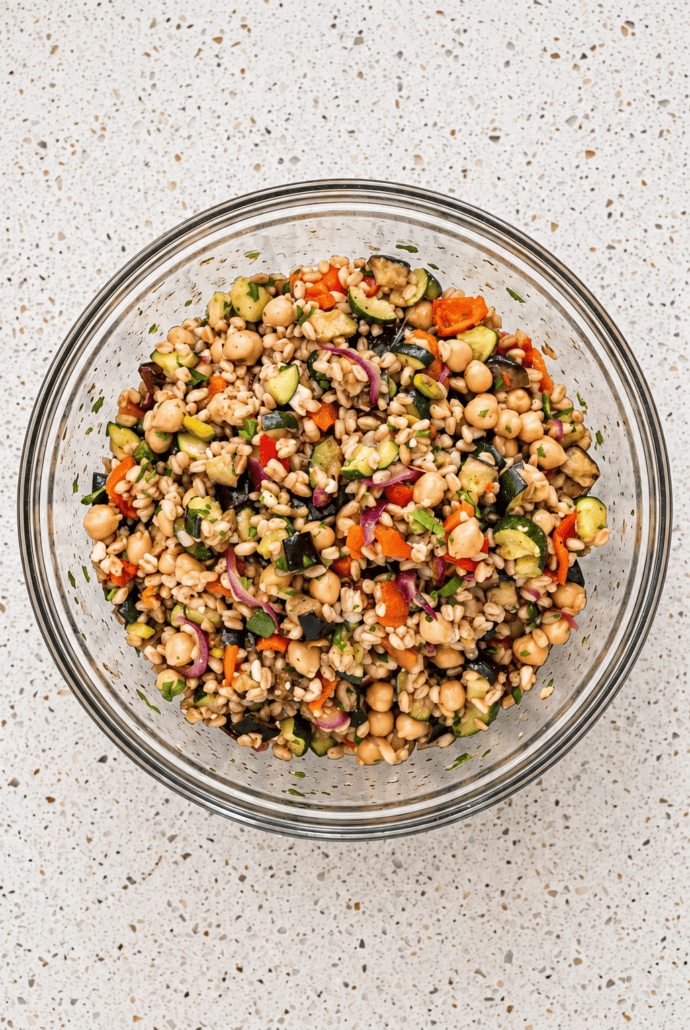Mediterranean farro salad with chickpeas, roasted vegetables, feta, and fresh parsley.