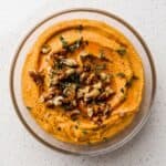 Pumpkin whipped feta topped with walnuts, fresh thyme, and honey for an easy fall appetizer.