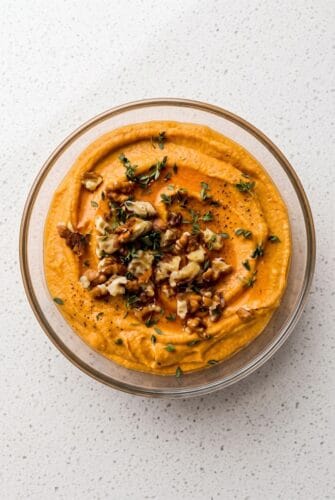 Pumpkin Whipped Feta with Honey and Walnuts Pumpkin whipped feta topped with walnuts, fresh thyme, and honey for an easy fall appetizer.