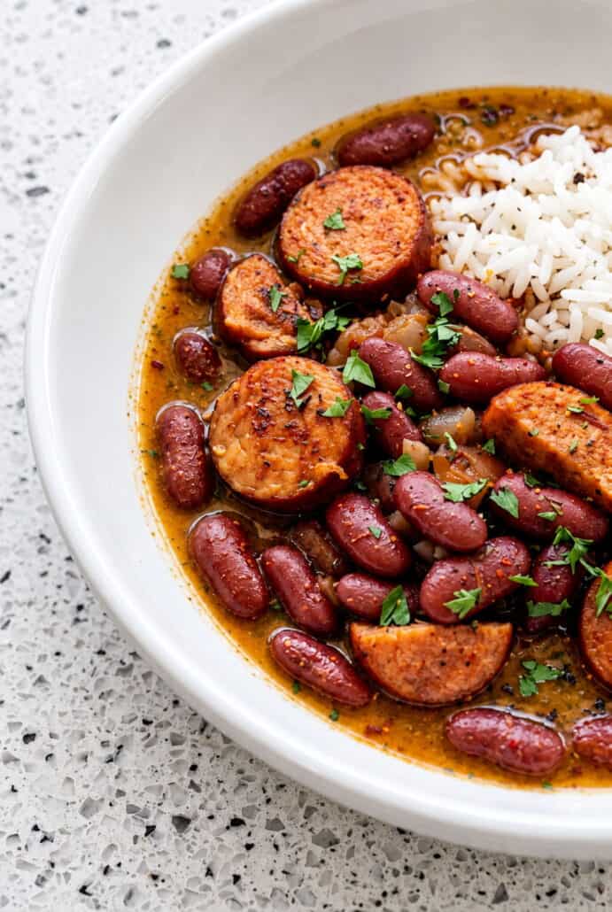 Red beans and Andouille sausage with white rice, showing a hearty serving of homemade red beans and rice.
