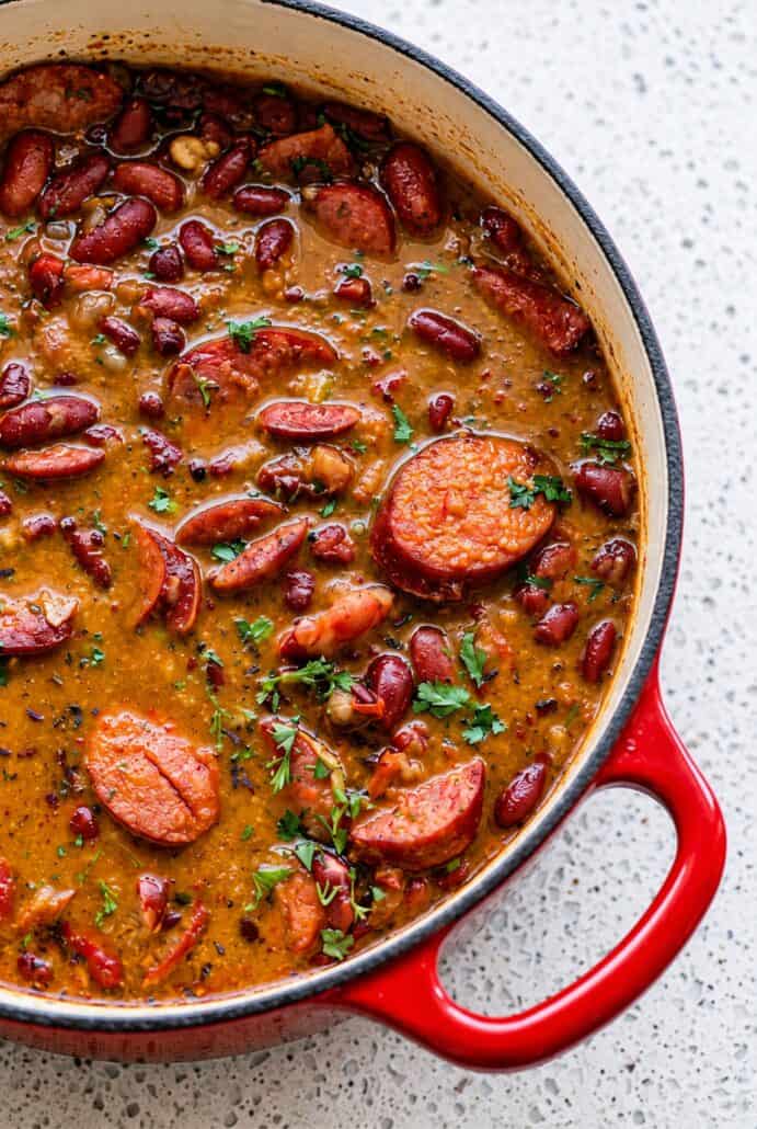Close-up of creamy red beans with Andouille sausage, showing the rich texture of the red beans and rice recipe.