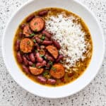 Red beans with Andouille sausage served over white rice, showing the finished red beans and rice recipe.