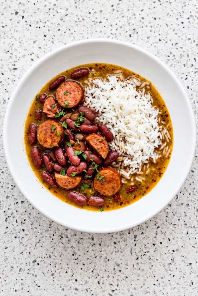 Red beans with Andouille sausage served over white rice, showing the finished red beans and rice recipe.