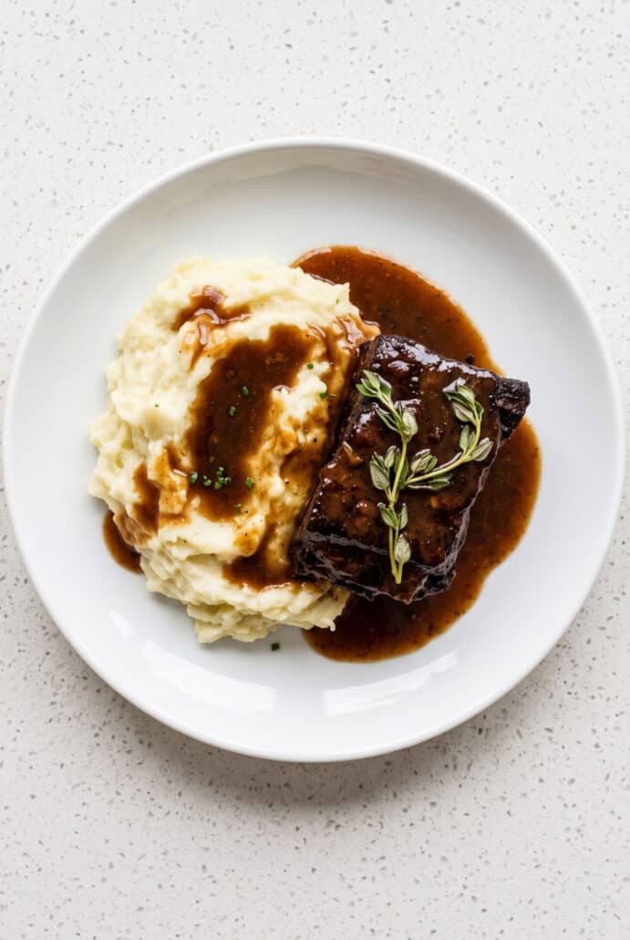 Red wine braised short rib served with creamy mashed potatoes.