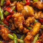 Sweet chili chicken and green bean stir fry with bell peppers in a sticky sauce.