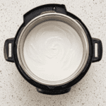 Creamy homemade Instant Pot yogurt in the inner pot, ready to chill and serve.