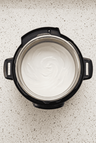 Easy Instant Pot Yogurt Recipe Creamy homemade Instant Pot yogurt in the inner pot, ready to chill and serve.