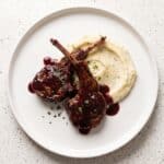 Pomegranate lamb chops served with creamy mashed potatoes and pomegranate sauce.